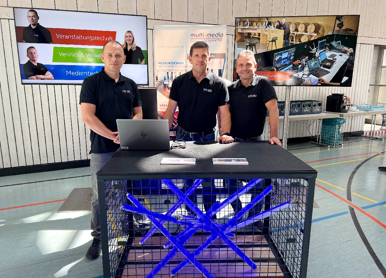Klaus Peterlik, Michael Heide und Torsten Eberle am Stand der multi-media systeme AG
